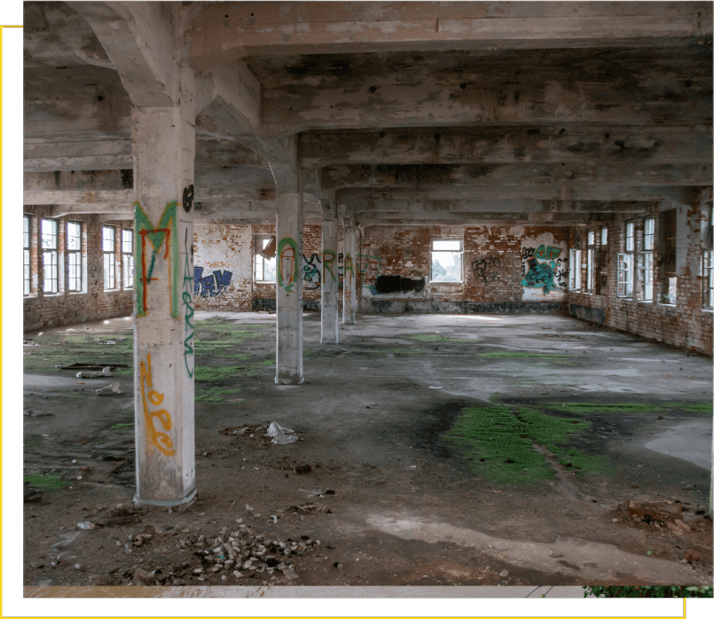 A large room with graffiti on the walls.